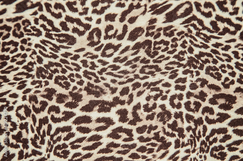 Leopard print pattern fabric texture repeat background effect leopard fabric sample.