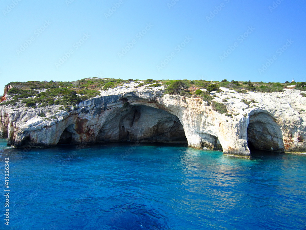 Excursion around the island of Zakynthos on a pleasure boat. Rocky shores of white limestone. White sand beaches. Greece
