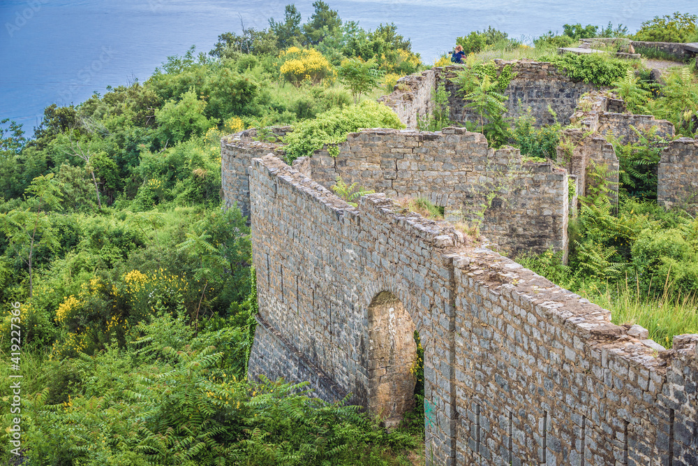 Historical walls of Mogren Fortress near Budva town on the Adriatic shore, Montenegro Historical walls of Mogren Fortress near Budva town on the Adriatic shore, Montenegro