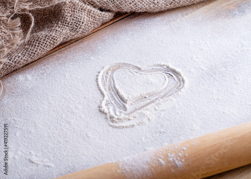 baking ingredients egg, flour, oil for baking on wooden background