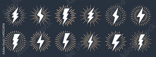 Set of vintage lightning bolts and sun rays isolated on white background. Lightnings with sunburst effect. Thunderbolt, electric shock sign. Vector illustration.