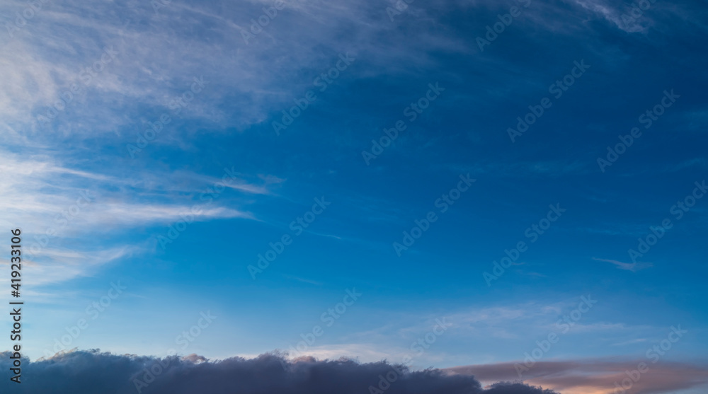 Obraz premium Beautiful bright sunset sky with clouds Nature sky background.