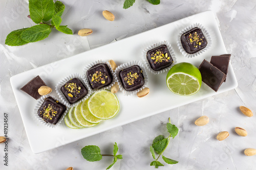 Sweet candy is their pure fruit. Healthy sweets - lollipops, fruit chips. Testi Sweets. Lime and mint. View from above photo