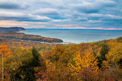 peak vibrant autumn foliage colors with Lake Michigan on the background.