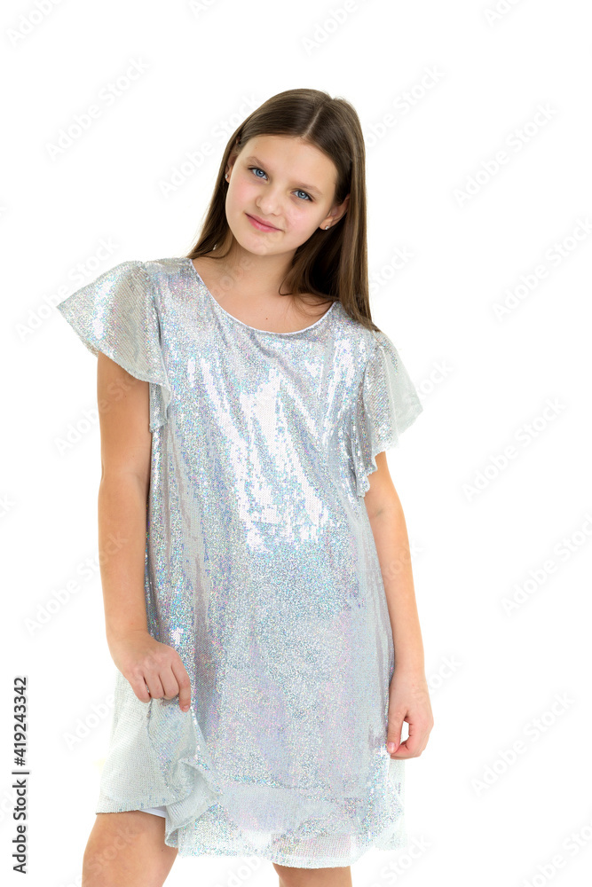 Beautiful long haired girl in shiny trendy dress Beautiful long haired girl in shiny trendy dress