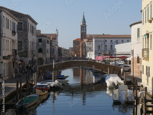 Chioggia, Vena Canal with colorful ancient buildings on both sides and crossed by ancient bridges