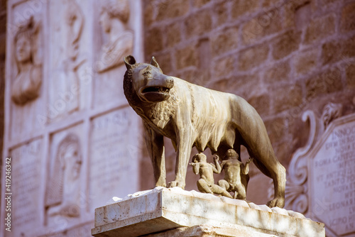 Monument of architecture sculptures of a lion, a wolf, an elephant and birds, ancient rome, their rulers of ancient rome photo