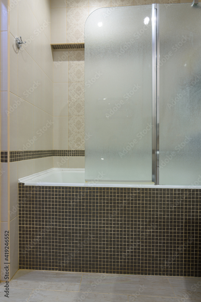 The bathroom is separated from the bathroom by a glass partition, the partition door is closed ...