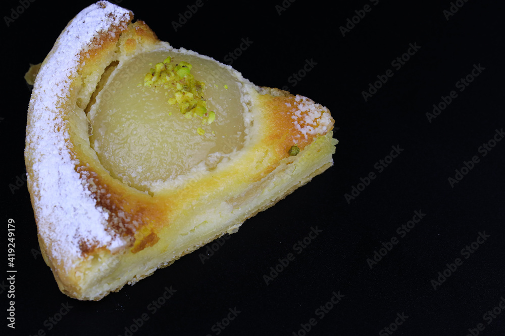 close up Pear Tart on Black background close up Pear Tart on Black background