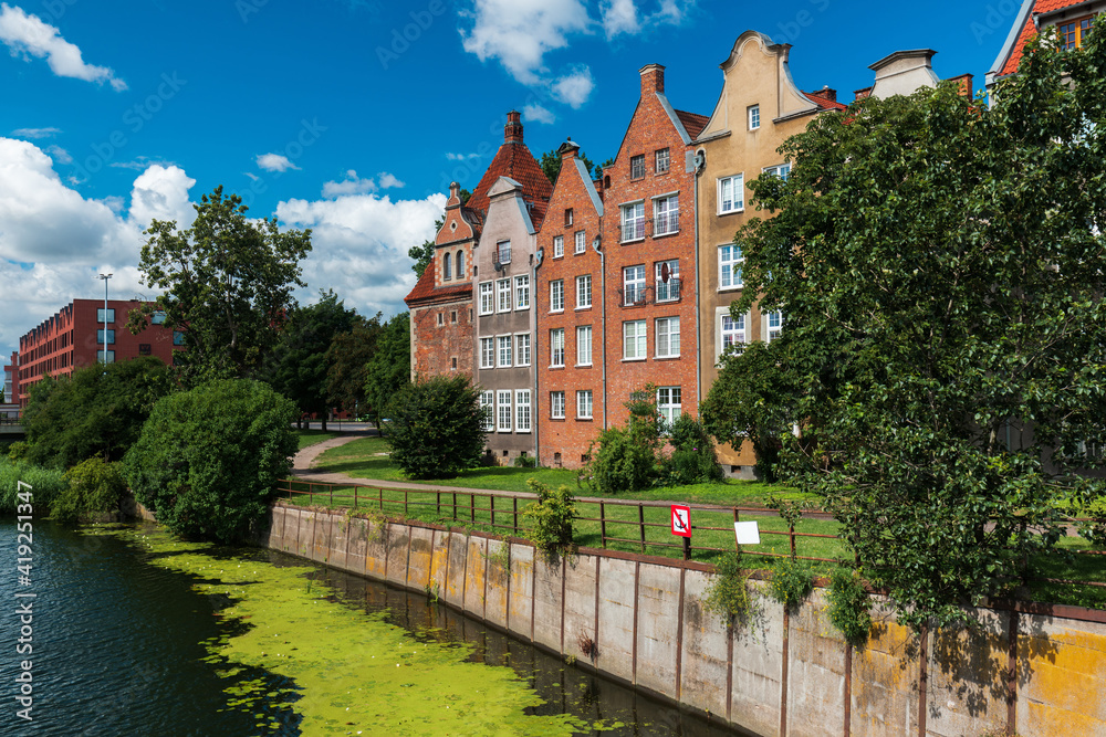Naklejka premium Beautiful old houses by the canal in old town of Gdansk, Poland