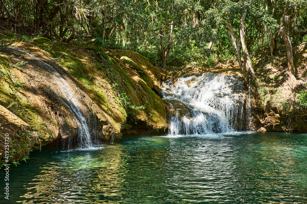 Fototapeta premium Cuba. Trinidad. Reserve Topes de Collante. Guanayar Park. The river flows into the lake
