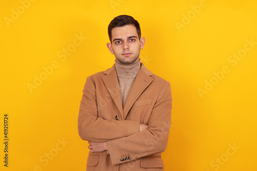isolated portrait of young man in coat