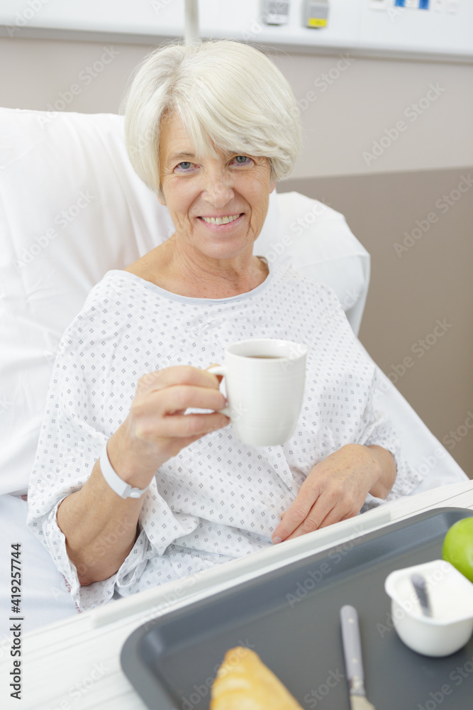elderly woman patient drinking tea at the hospital elderly woman patient drinking tea at the hospital