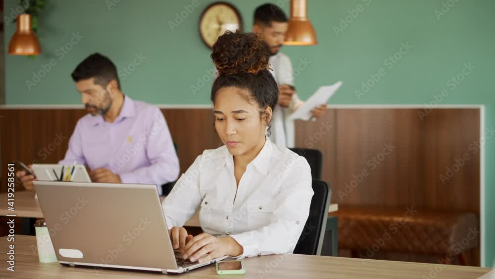 black business woman talking to business colleague at office desk
black business woman talking to business colleague at office desk