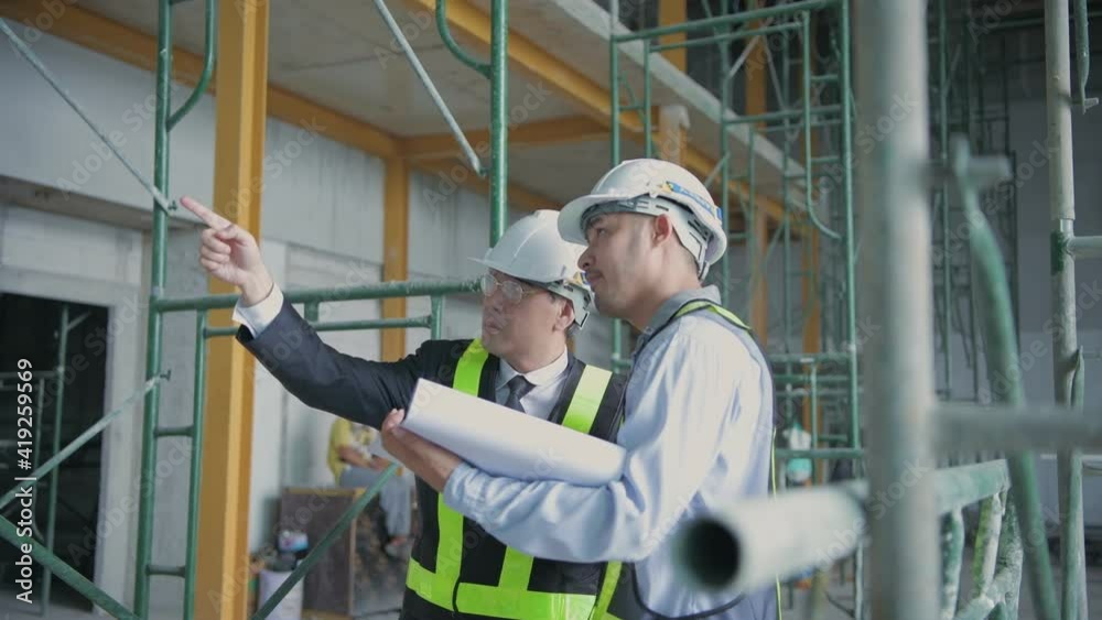 Engineer concept of 4k Resolution. Business people plan construction work in the building. Engineer concept of 4k Resolution. Business people plan construction work in the building.