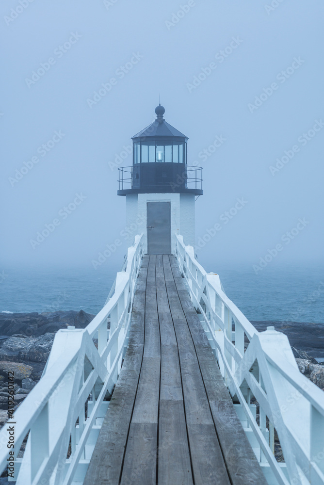 USA, Maine, Port Clyde. Marshall Point Lighthouse in the fog.