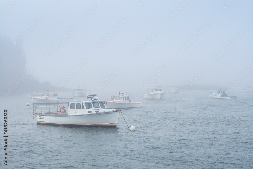 USA, Maine, Port Clyde. Port Clyde Harbor, boats in the fog.