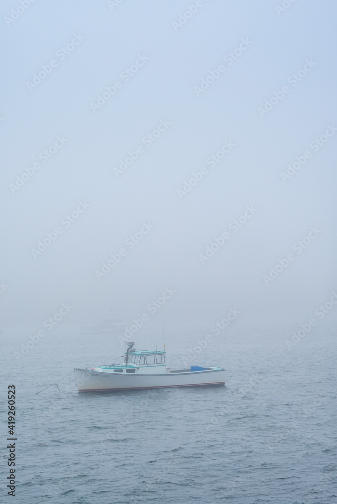 USA, Maine, Port Clyde. Port Clyde Harbor, boats in the fog.