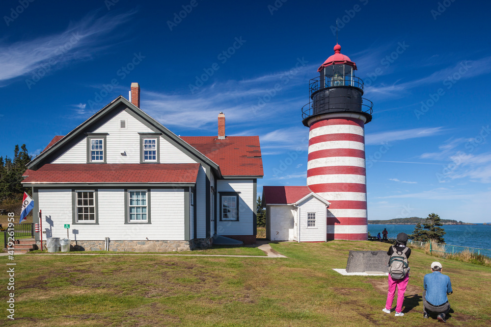 USA, Maine, Lubec. West Quoddy Head Light with visitors. USA, Maine, Lubec. West Quoddy Head Light with visitors.