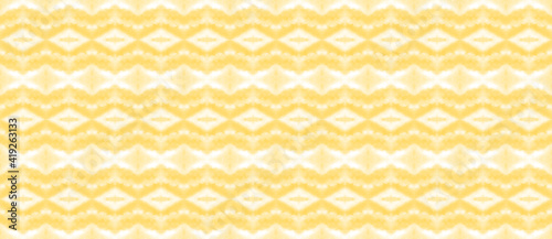 Seamless decorative pattern of blurry lines in light yellow color, warm sunny shade