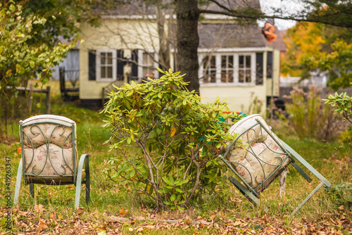 USA, Maine, Eastport. Old lawn furniture during autumn.