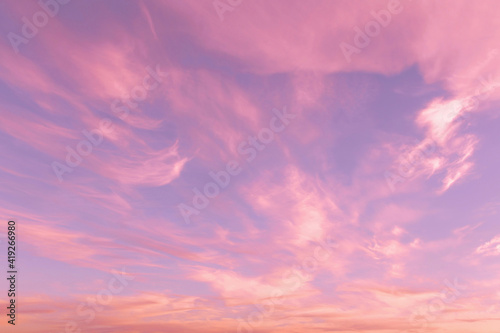 Dramatic sunrise, sunset pink violet blue sky with cirrus clouds abstract background texture