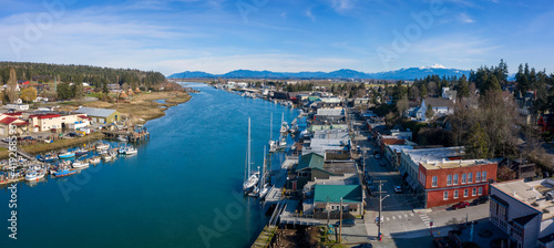 Aerial View of the Tourist Town La Conner, Washington. La Conner is one of the best places to visit in spring with its brilliant fields of daffodils and the yearly Skagit Valley Tulip Festival. © LoweStock