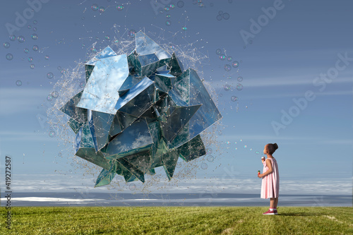 Girl blowing bubbles forming dimensional structure reflecting sea photo