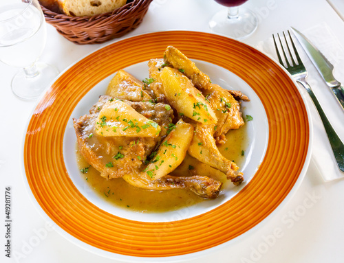 Chicken braised with pears in cava and cinnamon sauce, spanish cuisine