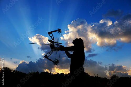 Silhouette of people playing archery