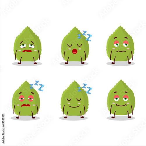 Cartoon character of basil leaves with sleepy expression