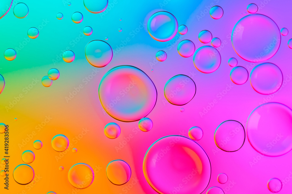 Vivid neon background with bubbles. Colorful abstract backdrop with bright gradients on blobs. Multicolor overflowing picture