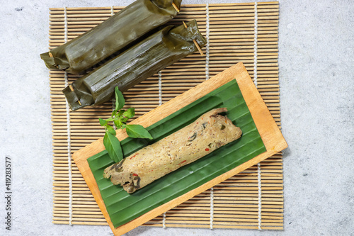 Foto Indonesia traditional food : pepes tahu kemangi or steamed tofu with asian basil