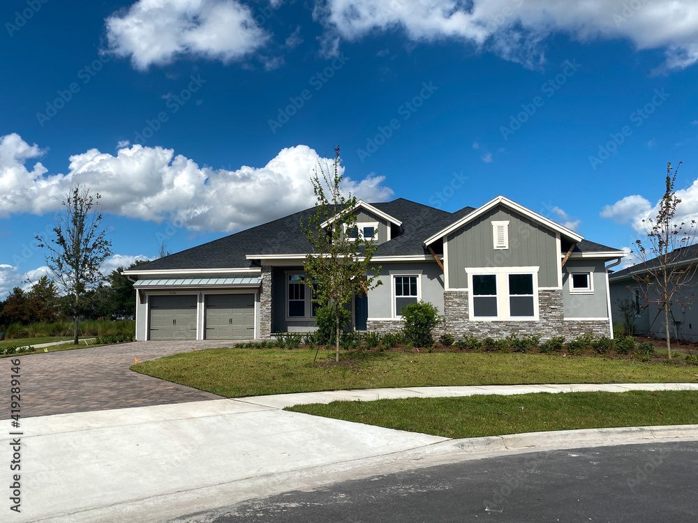 A luxury gray house in the Laureate Park neighborhood