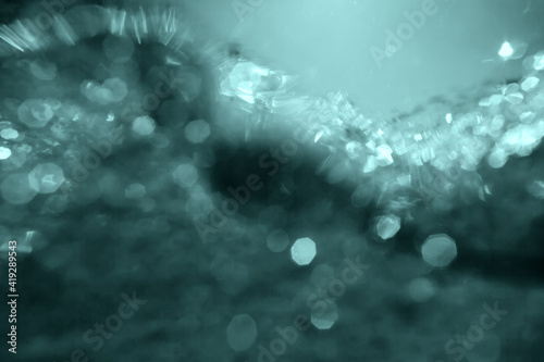 underwater bokeh tidewater green background. elegant abstract backdrop. 2021 palette colour