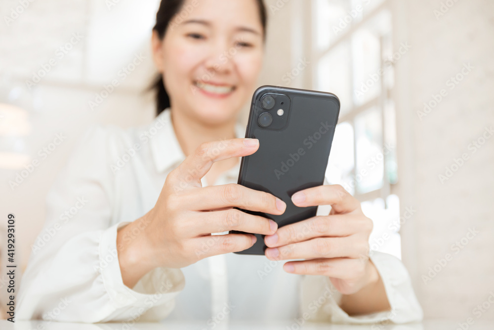 woman work using cell phone hand holding mobile texting message contact us.chatting,search internet information in office.technology device communication connecting woman work using cell phone hand holding mobile texting message contact us.chatting,search internet information in office.technology device communication connecting