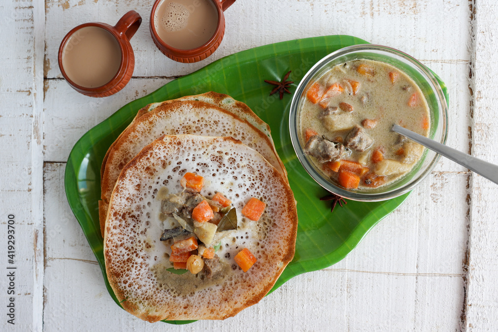 Appam, Hoppers and mutton stew Kerala breakfast food and Indian milk ...