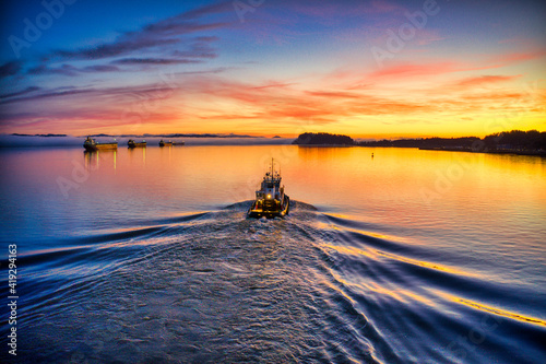 boat underway at sunrise