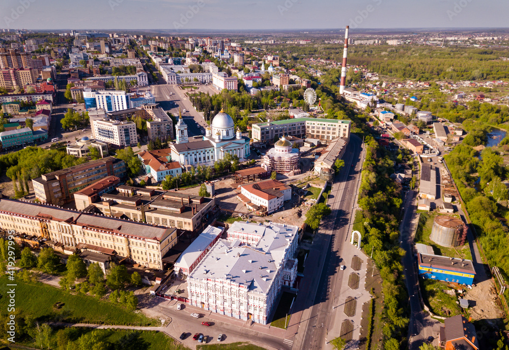 Scenic view from drone of historic center of old Russian town of Kursk with Znamensky Cathedral and Resurrection Church during restoration..