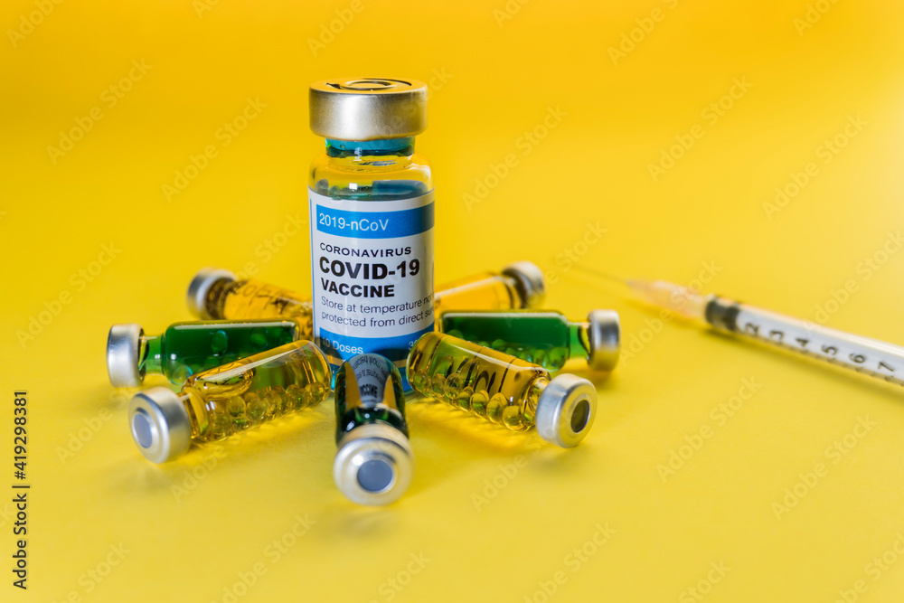 Vaccine for Coronavirus or Covid 19 with Yellow background. Medical and healthcare concept. Vaccine for Coronavirus or Covid 19 with Yellow background. Medical and healthcare concept.