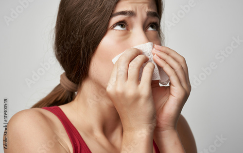 sick woman in red t shirt health problems cold handkerchief