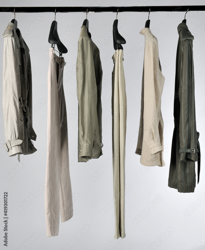 Elegant and trendy men's clothes hanging Elegant and trendy men's clothes hanging