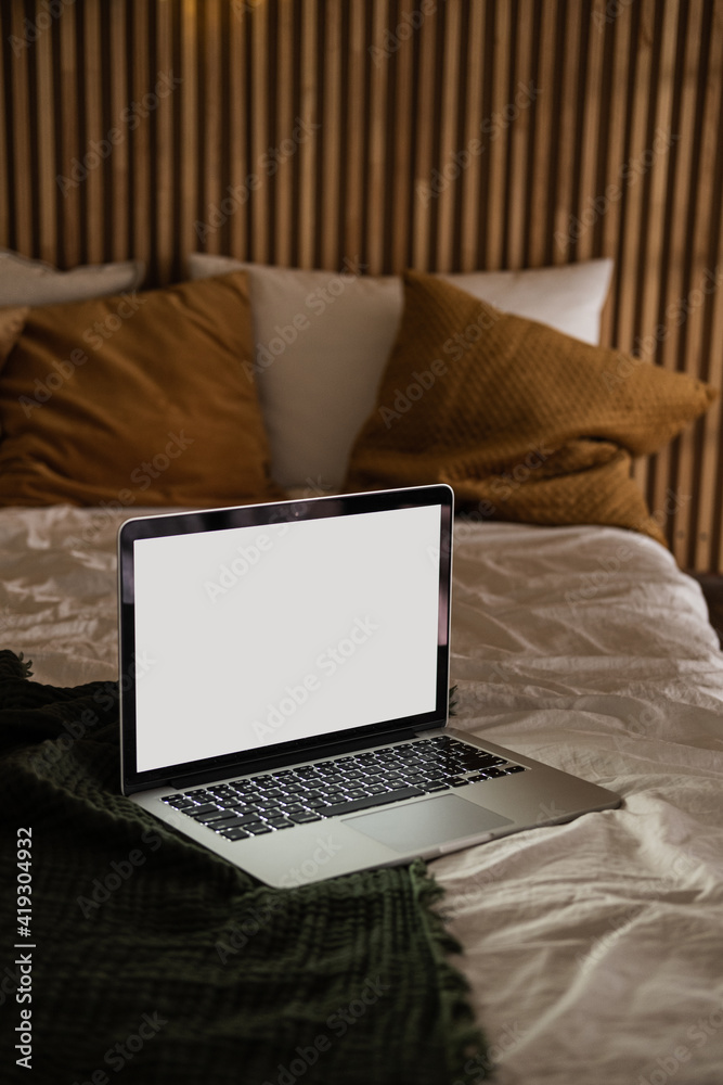 Laptop computer with blank screen in bed with pillows and blanket.  Aesthetic minimal home, bedroom interior design template with mockup copy  space. Work at home, quarantine self-isolation concept. Stock Photo | Adobe