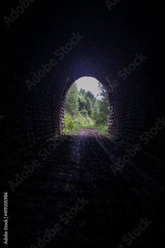 leaving the dark tunnel into the sun-lit nature