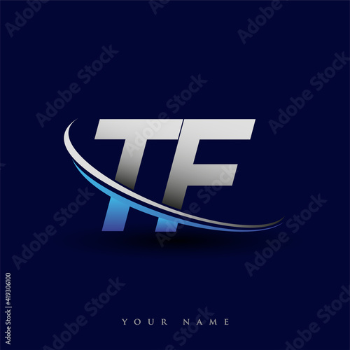 initial letter TF logotype company name colored blue and grey swoosh design. vector logo for business and company identity. photo