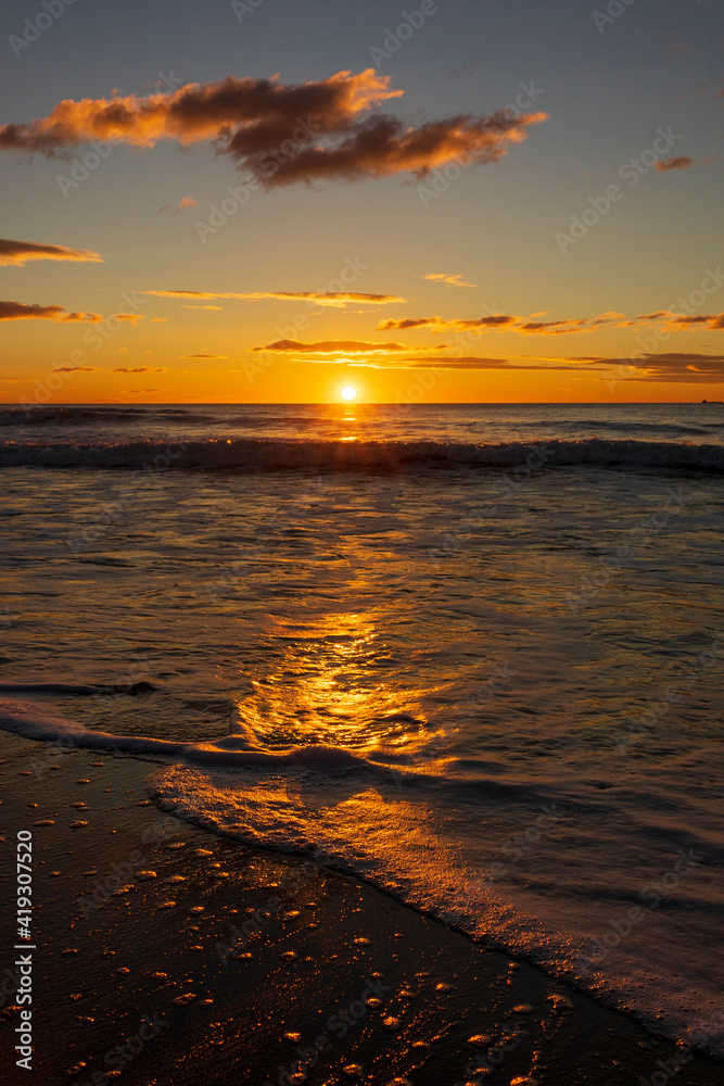 A beautiful sunrise from the shore of the beach