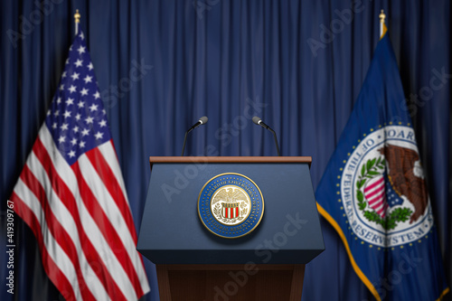 Federal Reserve System Fed of USA chairman press conference concept. Tribune with symbol and flag of FRS and United States. photo