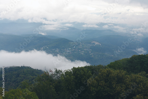 View from the top of the mountain on the clouds crowning the country of Western Caucasus.