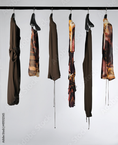 Elegant and trendy women's clothes hanging