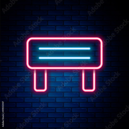 Glowing neon line Sauna wood bench icon isolated on brick wall background. Colorful outline concept. Vector.